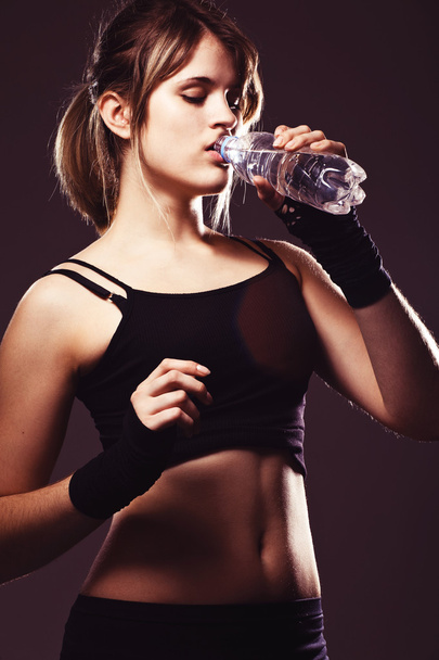Sports woman drinks water - Photo, Image