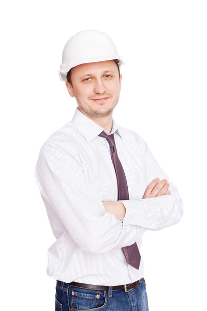 Engineer with white hard hat standing confidently isolated on wh - Fotografie, Obrázek