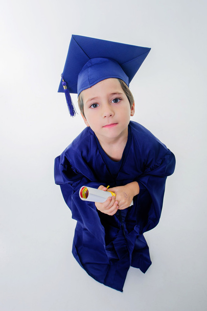 Little boy, just graduated student, looking up. - Photo, Image