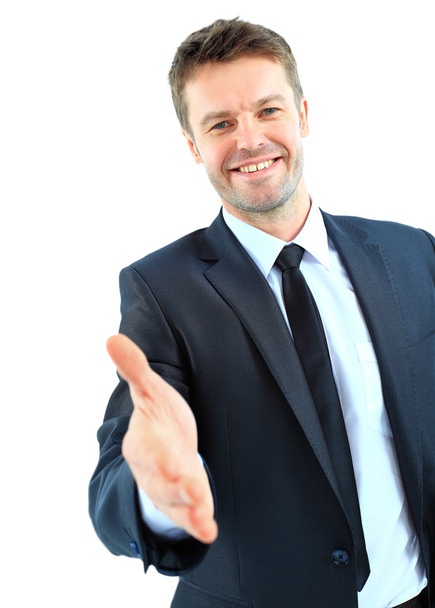 Счастливый улыбающийся бизнесмен протягивает руку за рукопожатие, изолированное на белом фоне
 - Фото, изображение