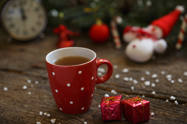 Close up of tea cup with christmas decoration on wooden table - Photo, Image