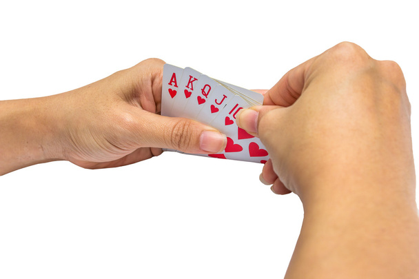 Игральные карты в руке изолированы на белом фоне - Фото, изображение