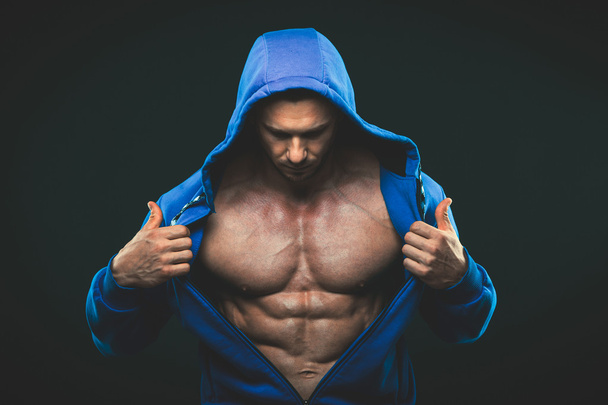 Man with muscular torso. Strong Athletic Men Fitness Model Torso showing six pack abs. - Fotó, kép