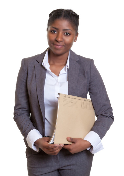 Smiling african business woman with file - Foto, Bild