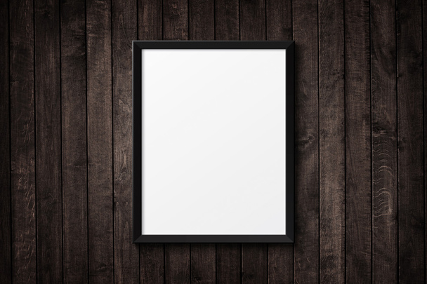 Blank black picture frame on the grunge wood texture. background - Photo, Image