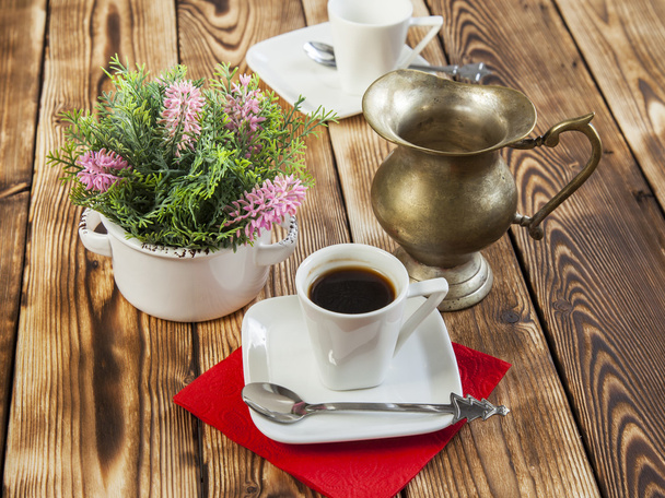 Cup of coffee of espresso and ancient metal small jug for milk - Fotografie, Obrázek