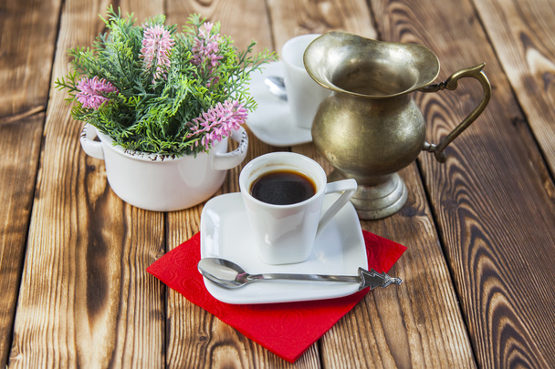 Cup of coffee of espresso and ancient metal small jug for milk - Fotografie, Obrázek