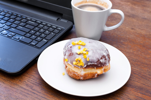 Fat Thursday - donut, coffee and a laptop. - Photo, Image
