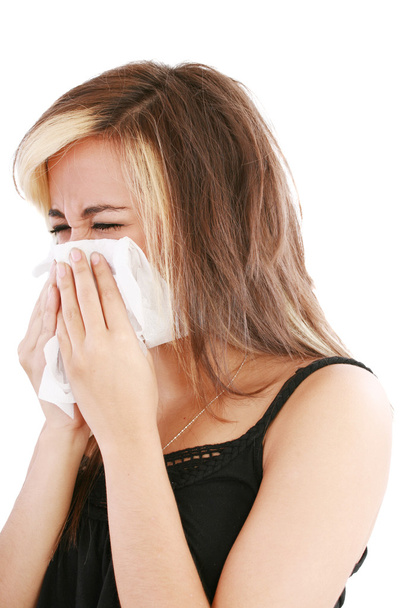 Closeup of gorgeous caucasian woman with cold sneezing into tiss - Photo, Image