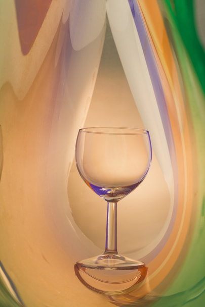 Wine glass on an abstract colored background - Φωτογραφία, εικόνα