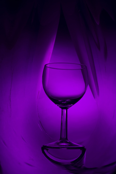 Wine glass on an abstract colored background - Photo, image