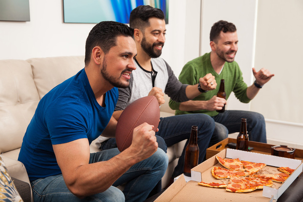 male friends cheering for their football team - Foto, Imagem