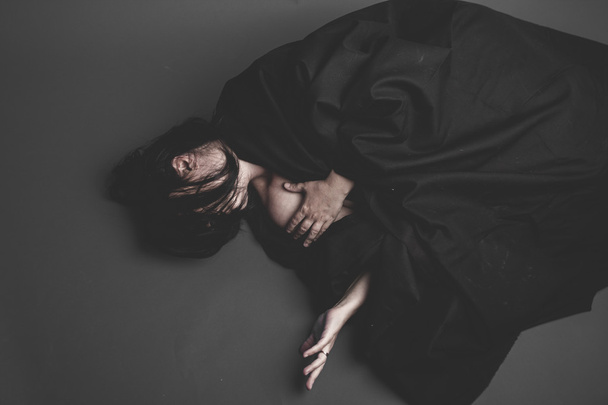 woman in black clothes  lying  - Photo, image