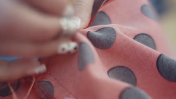 Closeup hands of seamstress at work with cloth fabric - Footage, Video