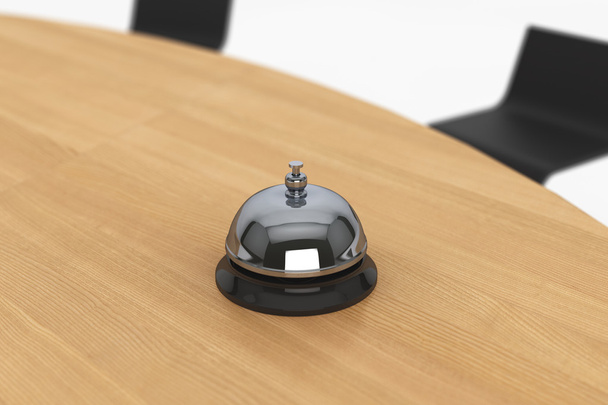 Obsługi dzwon na drewnianym stole - Zdjęcie, obraz