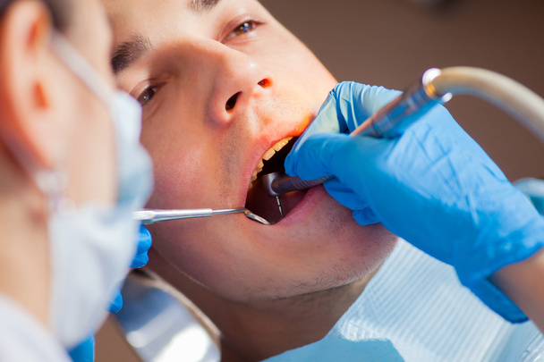 Dentist treatment a patients teeth in the dentist. - Valokuva, kuva