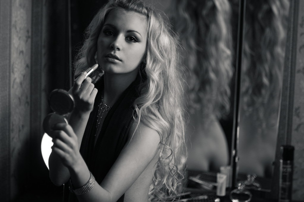 Young blond over the mirror - Fotó, kép