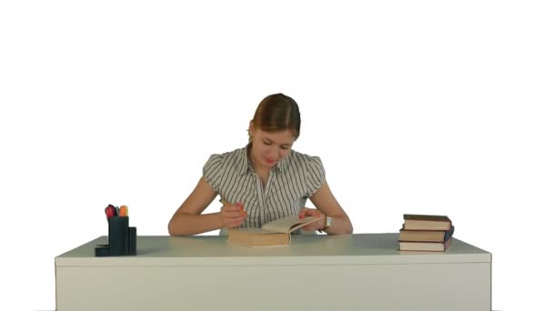 Beautiful female student read book on white background isolated - Πλάνα, βίντεο