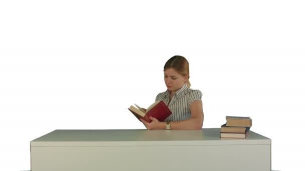 Female student reading a book for finding information on white background isolated - Footage, Video