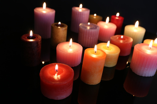 Many burning small candles on dark background, close-up - Fotó, kép