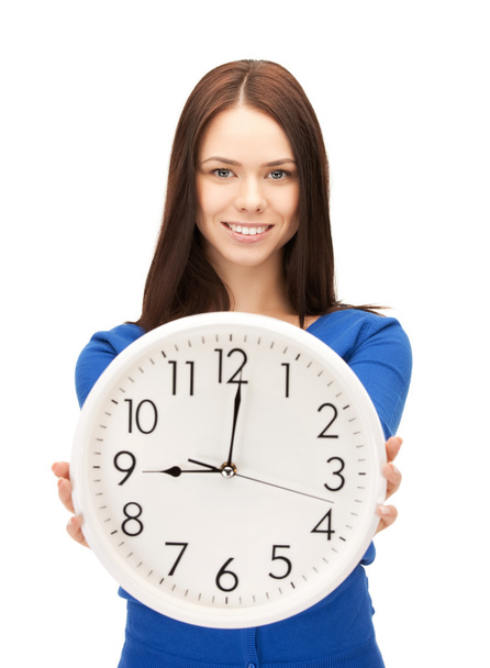 Woman holding big clock - 写真・画像
