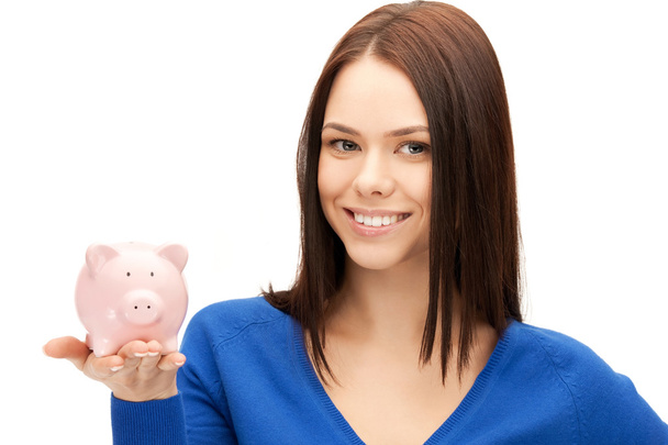 Lovely woman with piggy bank - Foto, afbeelding
