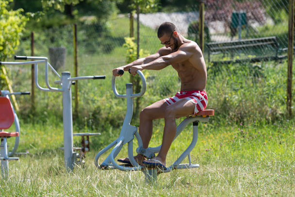 Muscular Man Training On The Playground In Park - Photo, Image