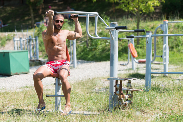 Muscular Man Training On The Playground In Park - Photo, image