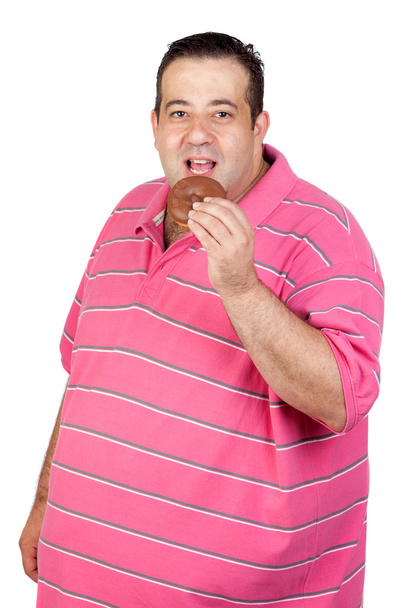 Hombre gordo comiendo una magdalena de chocolate
 - Foto, Imagen
