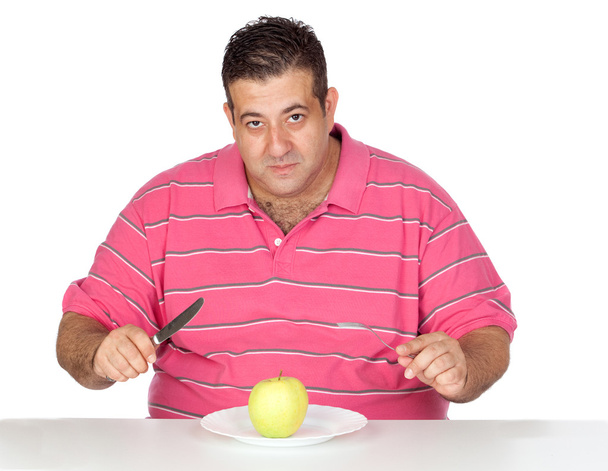 Fat man eating a apple - Foto, Imagem