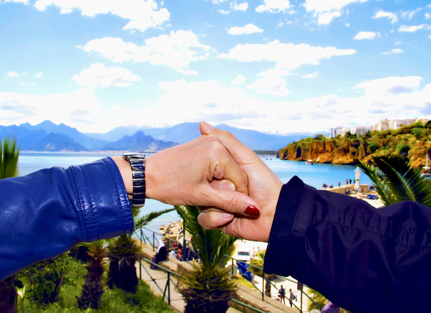 Happy couple holding hands.focus on hands. - Zdjęcie, obraz