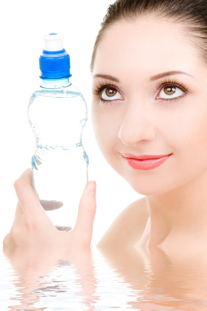 Pretty woman with bottle of clean water - Foto, afbeelding