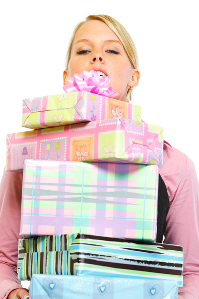 Woman looking out from stack of present boxes - Фото, изображение