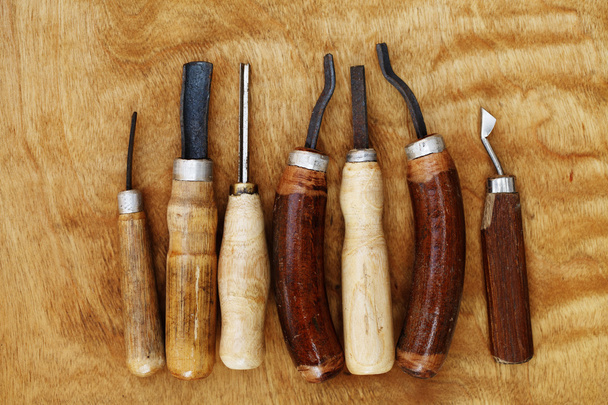 carving tool closeup on wooden background - Fotografie, Obrázek