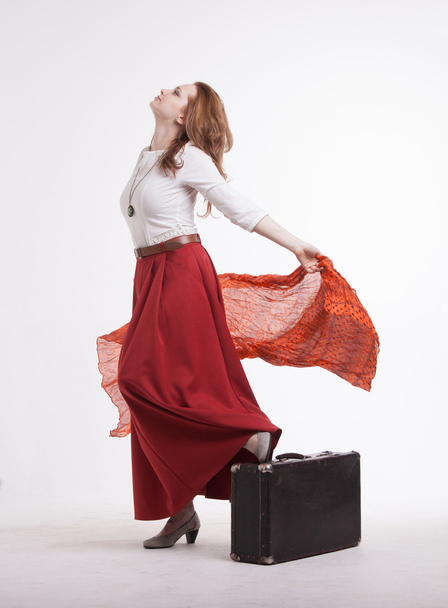 woman in skirt dancing with a red handkerchief - Foto, Imagen