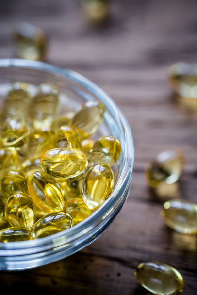 Omega-3 capsules in the glass bowl - Photo, Image