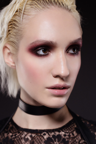 Girl with red smoky eyes makeup - 写真・画像