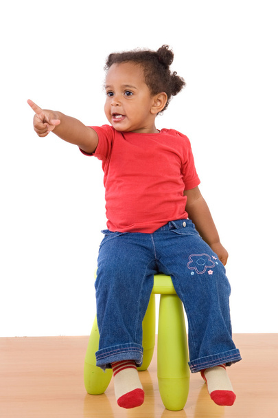 African baby sitting on a stool - 写真・画像