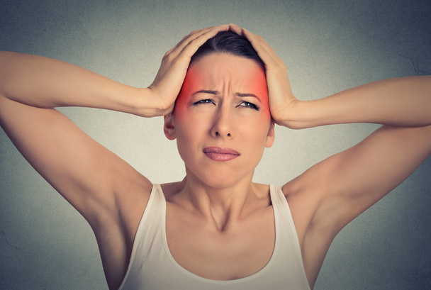 beautiful woman suffering from head ache isolated on gray wall background  - Fotoğraf, Görsel
