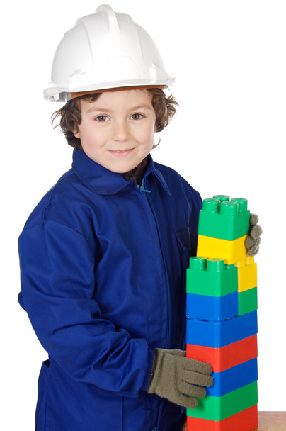 Adorable future builder constructing a brick wall with toy piece - Foto, Bild