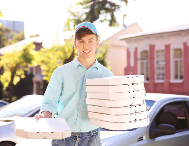Delivery boy with pizza boxes - Foto, immagini