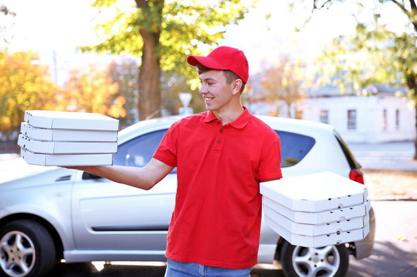 Delivery boy with pizza boxes - Foto, immagini