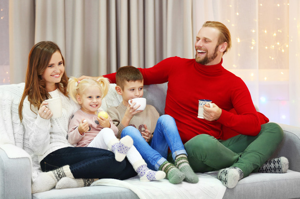 Christmas family in holiday living room - 写真・画像