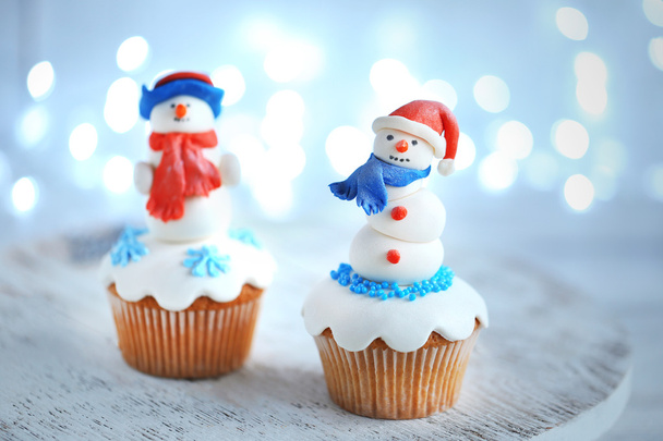 Christmas cupcakes with lights on background - 写真・画像