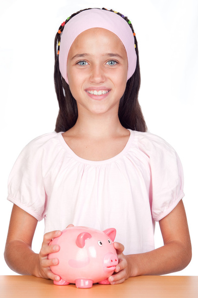 Little girl with with piggy-bank - Φωτογραφία, εικόνα
