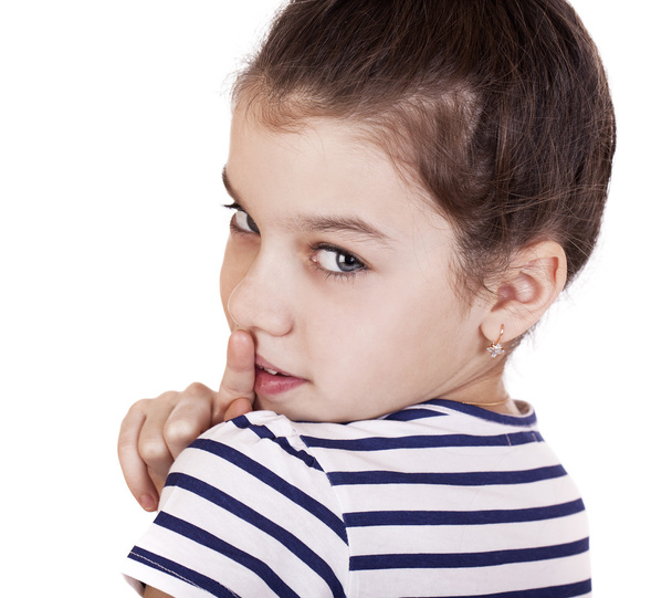 Little girl has put forefinger to lips as sign of silence - Valokuva, kuva