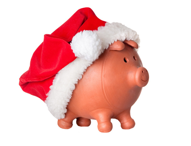 Piggy bank met kerstman hoed - Foto, afbeelding