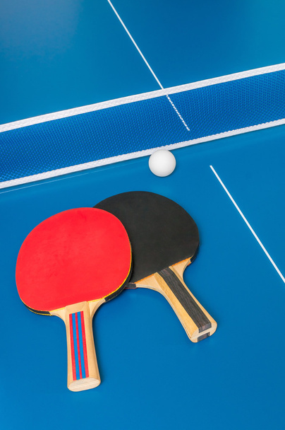 Sport game concept. Ping pong rackets and ball on table. - Zdjęcie, obraz