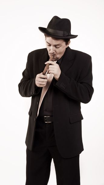 Man smokes cigar - Фото, изображение