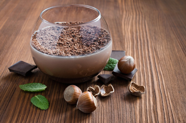 Chocolate mousse dessert with mint and hazelnuts - Photo, Image